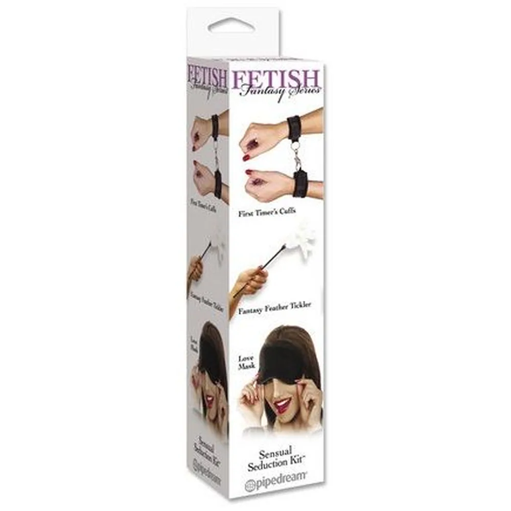 Emballage blanc du kit de séduction Fetish Fantasy Series montrant ses trois accessoires : entraves noires rembourrées, plumeau blanc et masque en satin noir