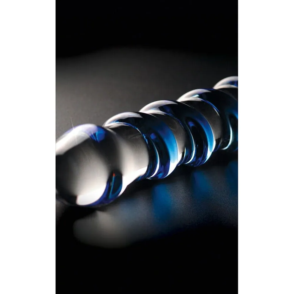 Masseur en verre transparent avec spirale bleue en relief, extrémité arrondie, base plate, sur fond blanc