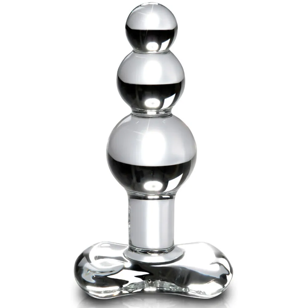 Plug anal en verre transparent avec trois sphères graduées empilées, col étroit et base évasée munie d'un anneau de retrait, sur fond blanc